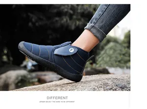 Side view of a navy blue winter snow boot with plush lining and F logo strap.