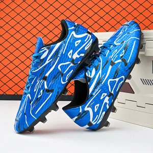 Professional blue patterned low-top soccer shoes with firm ground cleats for training