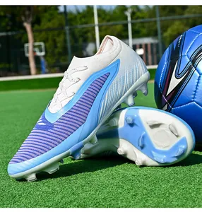 Professional seamless flyknit soccer cleats with firm ground studs shown in detail on turf.