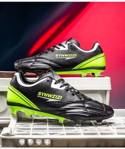 Side view detail of breathable black soccer cleats with vibrant lime green soles