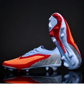 Detail showing the firm ground studs and flyknit texture of these colorful soccer cleats