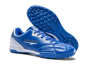 Blue and white breathable synthetic turf soccer shoes featuring durable rubber studs and logo