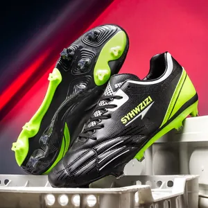 Professional black and lime green soccer cleats with high-performance studs for youth.