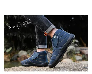 Detailed view of stylish blue fleece-lined snow boots perfect for outdoor winter sports