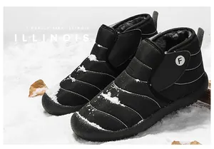 Close-up view of black quilted winter snow boots with warm thermal lining for outdoors