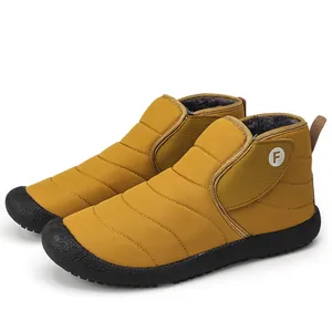 Water-resistant winter puffer snow boots with warm fleece lining in mustard yellow color