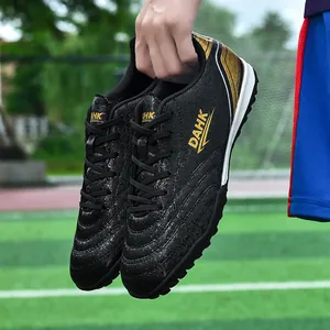 Professional black and gold TF turf soccer shoes for students' training and matches
