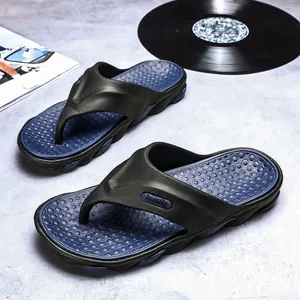 Trendy men's black and navy flip-flops for summer outdoor beach wear, stylish design.