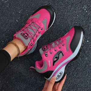 Close-up detail of women's pink hiking shoe featuring breathable mesh and air cushion sole.