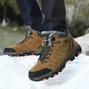 Durable waterproof high-top winter hiking boots for men and women standing in snow