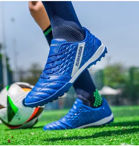Blue textured low-top turf soccer shoes for outdoor grass training and athletic sports