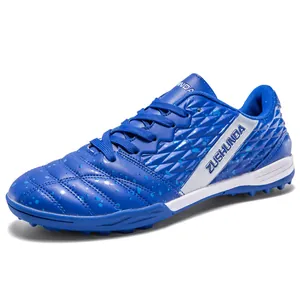 Professional blue turf soccer shoes for outdoor grass training with textured upper