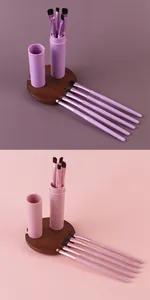 Detailed view of 5-piece portable makeup brush set in purple and pink with storage tubes