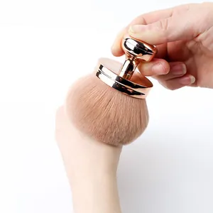 Professional large mushroom head makeup brush with soft bristles and rose gold stamp handle