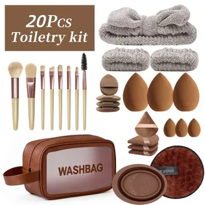 Set completo de 20 brochas de maquillaje y esponjas con neceser de viaje marrón.