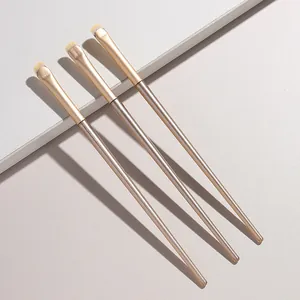 Set of professional small crescent makeup brushes for detailed eyeshadow and tear bag