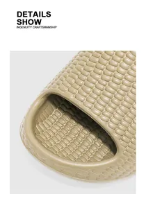 Close-up detail of textured bubble slides in khaki with thick non-slip sole
