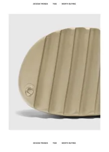 Close-up detail of textured non-slip sole on trendy thick-bottom beach slides.