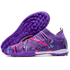 Vibrant purple turf soccer shoes with colorful patterns and TF studs for artificial grass.