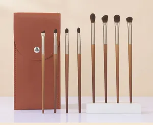 Professional 8-piece eye makeup brush set with an elegant brown faux leather pouch.