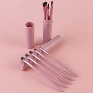 Detail view of 5-piece pink makeup brush set with matching portable storage tube