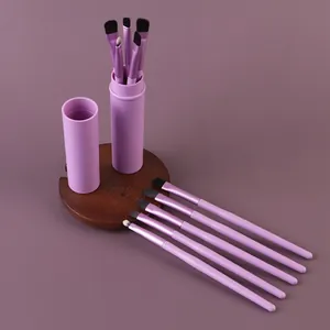 Detailed view of 5-piece lavender makeup brush set with a matching storage tube.