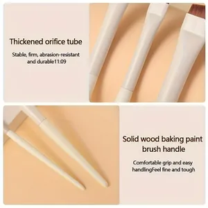 Detail view of makeup brush with thickened orifice tube and solid wood handle