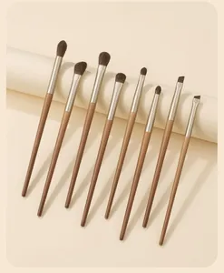 Close-up detail of 8-piece professional eye makeup brush set with gradient wood handles