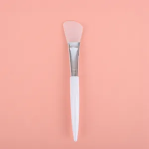 Soft silicone facial mask applicator brush with white handle for professional skin care