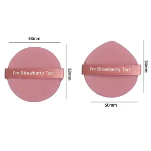 Detailed macro view showing dimensions of pink cushion makeup puffs for foundation