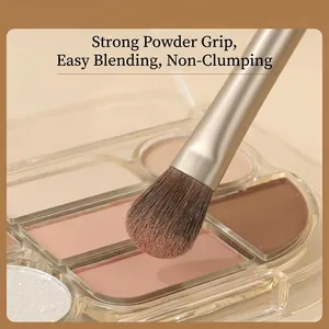 Professional eye shadow blending brush with soft bristles and premium gold metallic handle