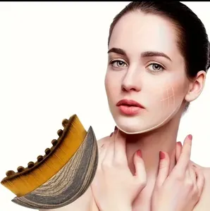 Detail view of a curved lymphatic contour brush demonstrating facial massage lifting effects.