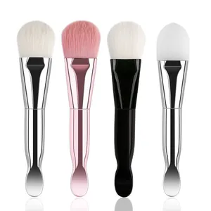 Detailed view of dual-ended makeup brushes with soft bristles and mask spatulas