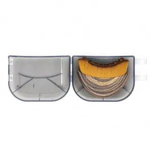Detail view of the lymphatic contour face brush with wood grain handle and clear storage case.
