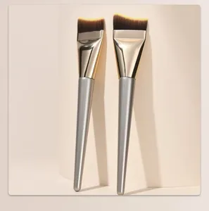 Set of two thin slanted crescent-shaped foundation makeup brushes with silver handles
