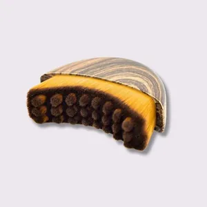 Lymphatic contour face brush with curved bristles and wood grain handle