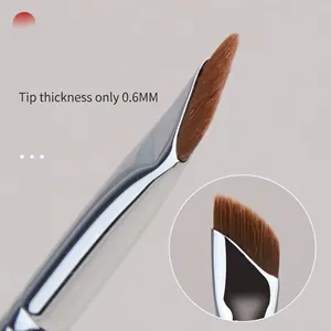 Professional ultra-thin sickle eyeliner brush with 0.6mm precision angled tip for eyes.
