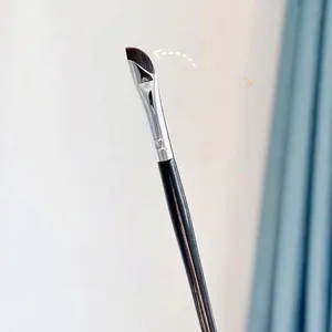 Ultra-fine sickle-shaped eyeliner and concealer brush for precise makeup application