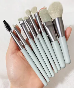 Macro detail view of 8pcs mini makeup brush set with soft bristles in light green handles