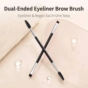 Detailed macro view of a double-ended eyebrow brush with angled tip and spoolie brush