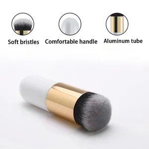 Detailed view of chubby makeup brush with soft bristles and gold aluminum tube