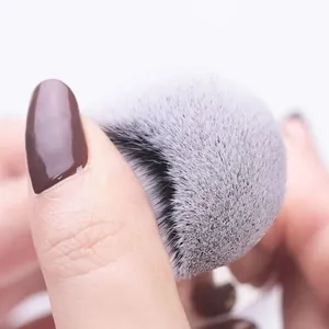 Close-up of dense, soft bristles on a portable makeup brush for flawless application