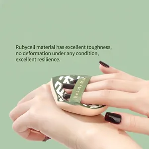 Soft marshmallow cushion puff for dry and wet makeup application on green background