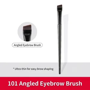 Macro view of ultra-thin angled eyebrow brush showing fine synthetic bristles and sleek handle