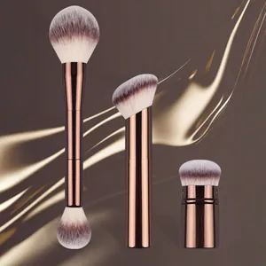 Close-up of professional rose gold makeup brushes featuring soft dual-tone bristles