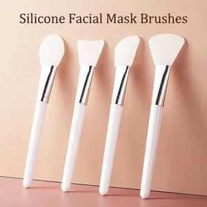 Professional Silicone Facial Mask Brush for Mud Mask Application Portable Beauty Tool with White Handle and Silver Tube