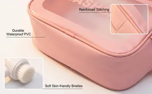 Detailed view of pink makeup bag with reinforced stitching and soft brush bristles