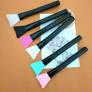 Set of multi-colored silicone face mask brushes with black handles for DIY skincare