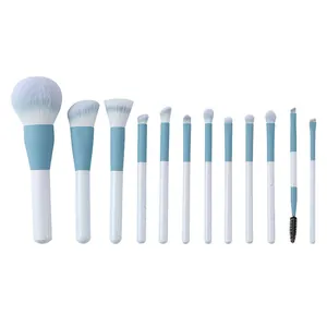 12-piece professional makeup brush set featuring soft blue and white synthetic bristles