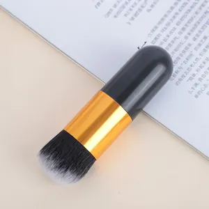 Macro view of a portable chubby foundation brush with dual-tone soft bristles.
